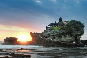 Uluwatu temple at sunset Bali — popular destination for private car tour